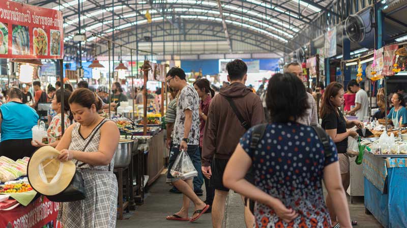 Checking out the local cuisine at a street food market in Thailand.