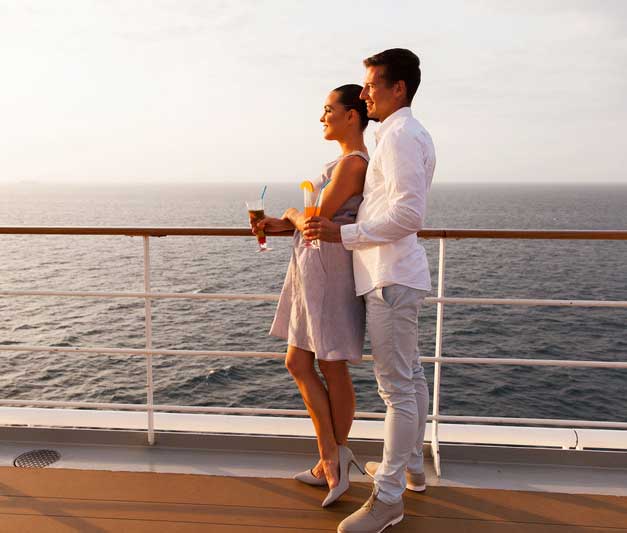 Couple relaxing on deck of cruise ship
